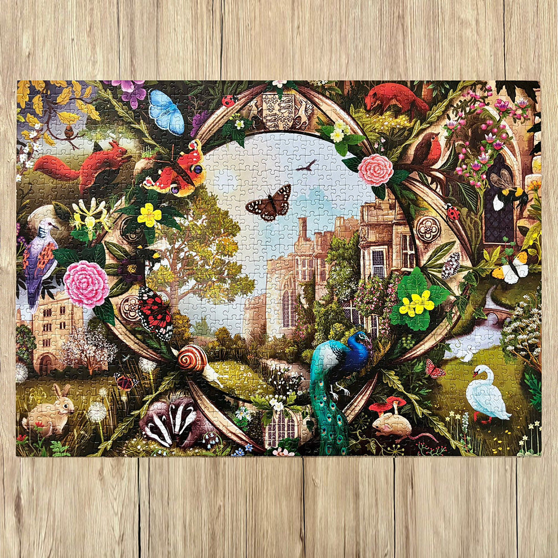 Haddon Hall 1000 Piece Jigsaw Puzzle by Gibsons made up on wooden table