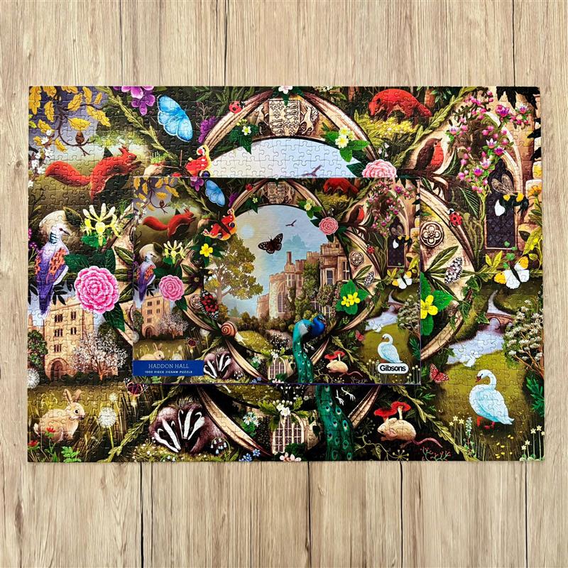 Haddon Hall 1000 Piece Jigsaw Puzzle by Gibsons made up on wooden table with box on top