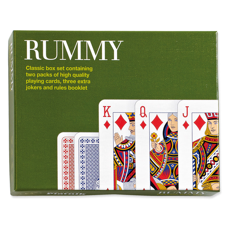 Rummy classic deck box set featuring an olive green box with white and yellow text, showing three face-up playing cards (Kings of diamonds, hearts, and clubs) and the backs of two more cards, with the text 'RUMMY' prominently displayed on the front.