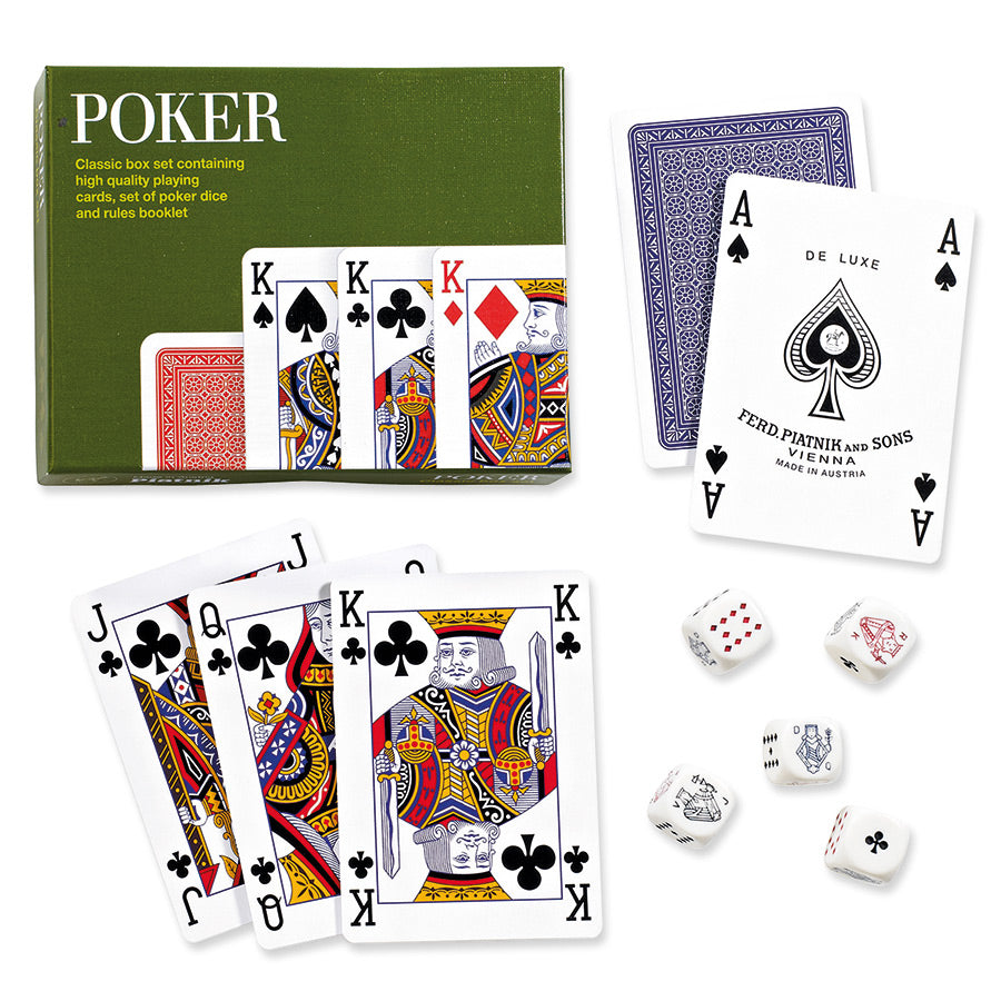 A classic deck of playing cards set with its green box, fanned face-up cards, blue-backed cards, and white dice on a clean white background.