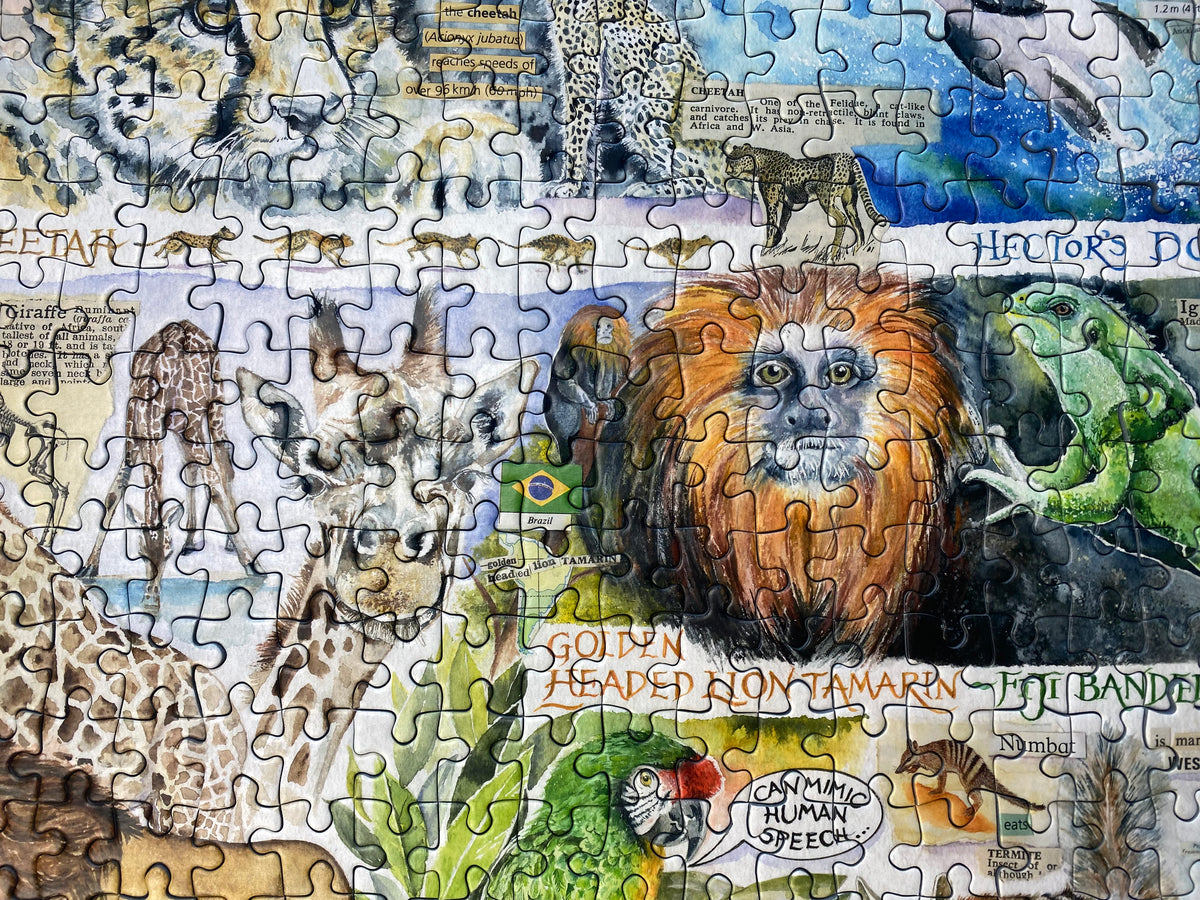 A completed jigsaw puzzle featuring a colourful collage of safari animals and nature illustrations, including a lion, giraffes, a leopard, a green frog, a parrot.