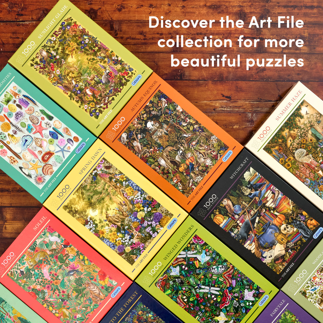 The Art File jigsaw puzzle collection together on wooden table