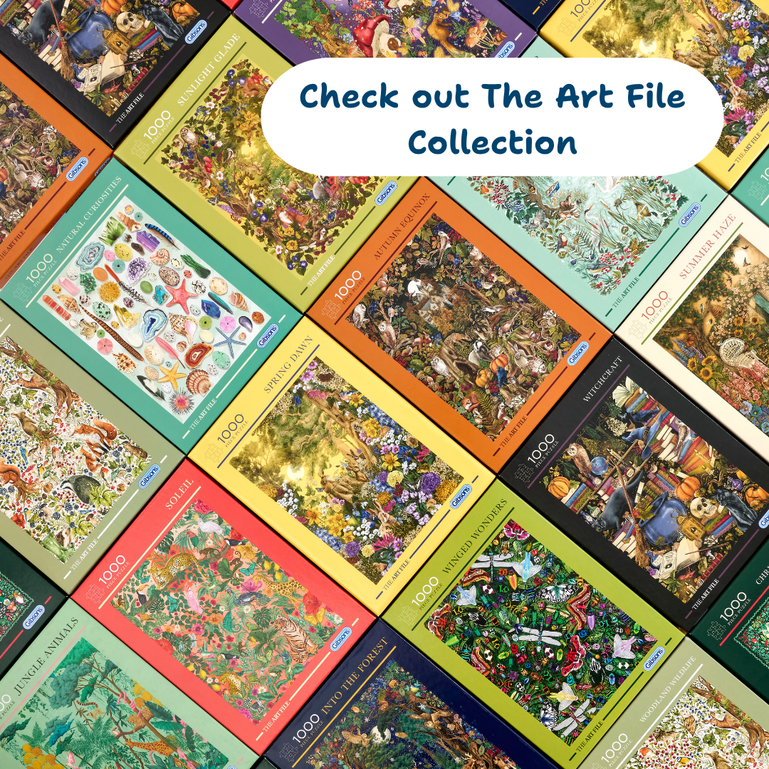 Collection of 'The Art File' puzzle boxes with colorful designs and text.