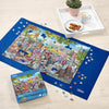 Jigsaw puzzle with completed pieces on a blue mat, partially completed puzzle, and packaging on a wooden surface.
