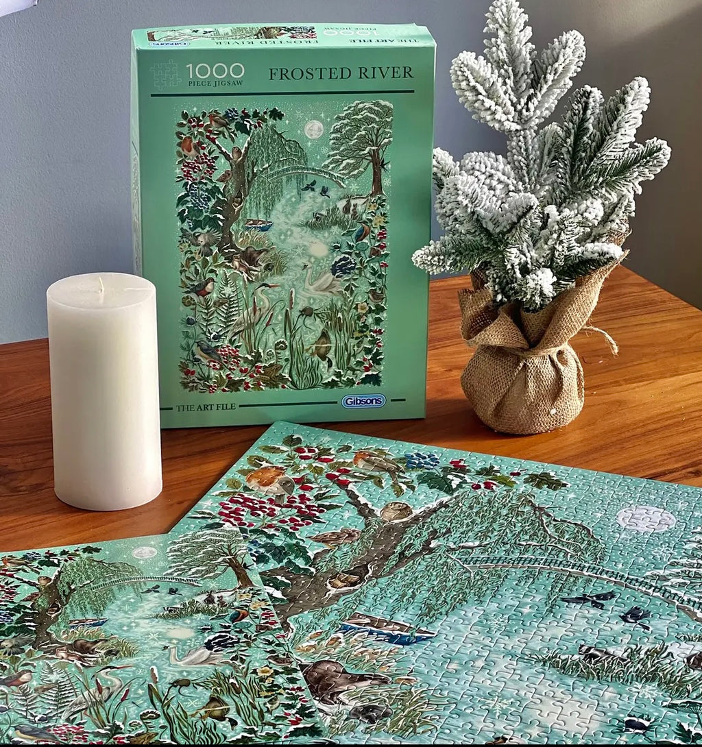 gibsons games the art file: frosted river 1000 piece jigsaw puzzle with white candle and mini frosted tree on table